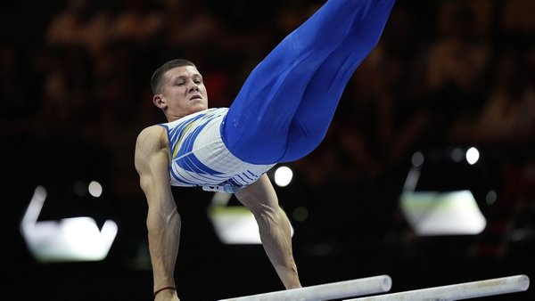 Ukraine’s Illia Kovtun competes to win a silver medal in the men’s parallel bars final at the European Gymnastics Championships in Munich, Germany, Sunday, Aug. 21, 2022. (AP Photo/Pavel Golovkin)